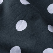 Close up detail shot of green slim fit boxer with white and drawn dots printed.